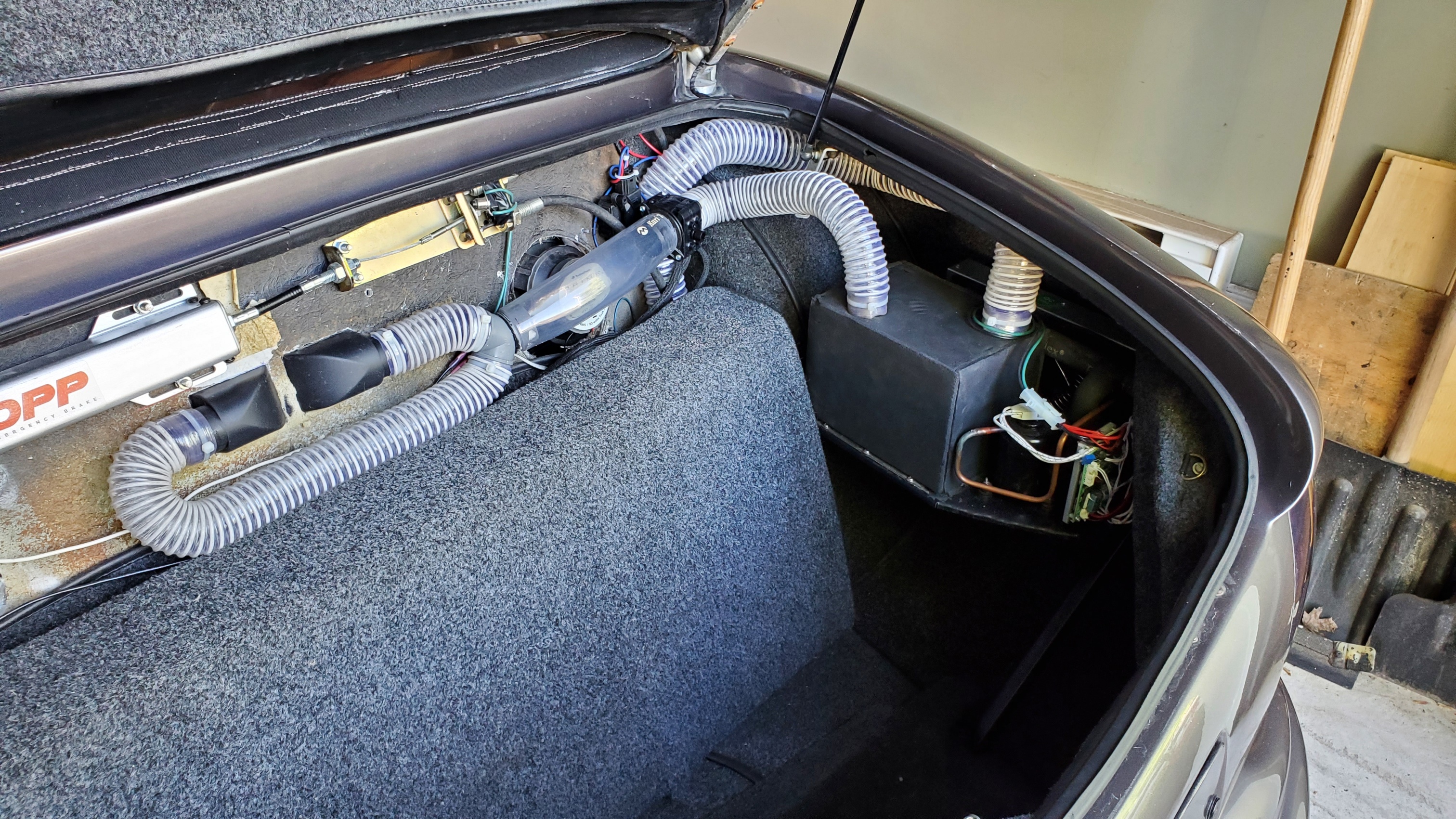 Micro DC Aircon module and air ducts installed in a vehicle compartment