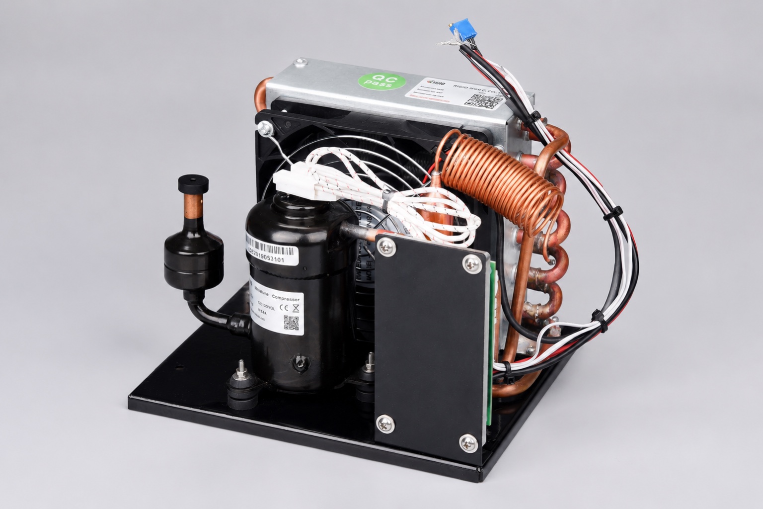 Miniature DC compressor and condenser assembly for a custom refrigerator installation