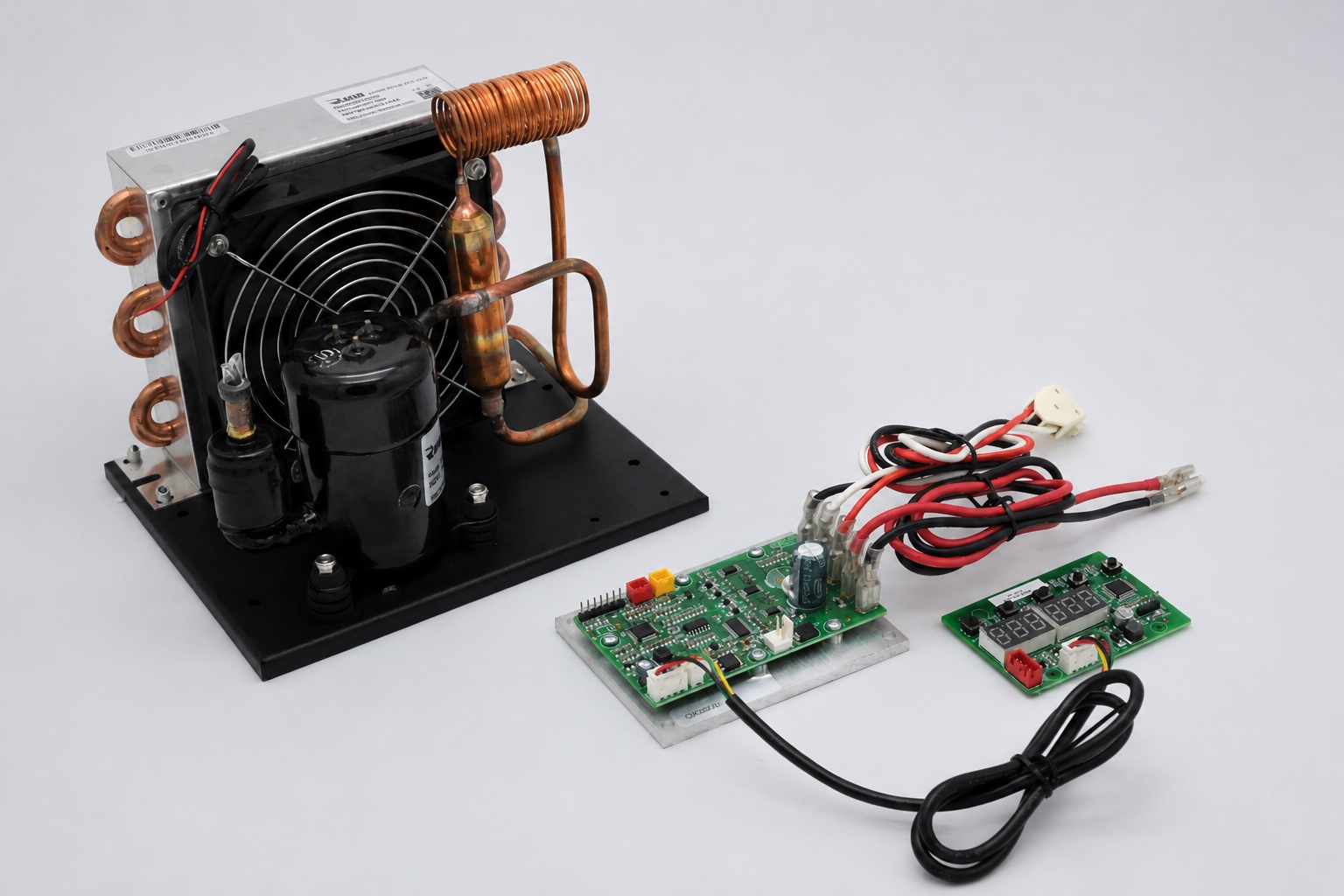 Miniature DC condensing unit with rotary compressor of the class discussed for cold starts