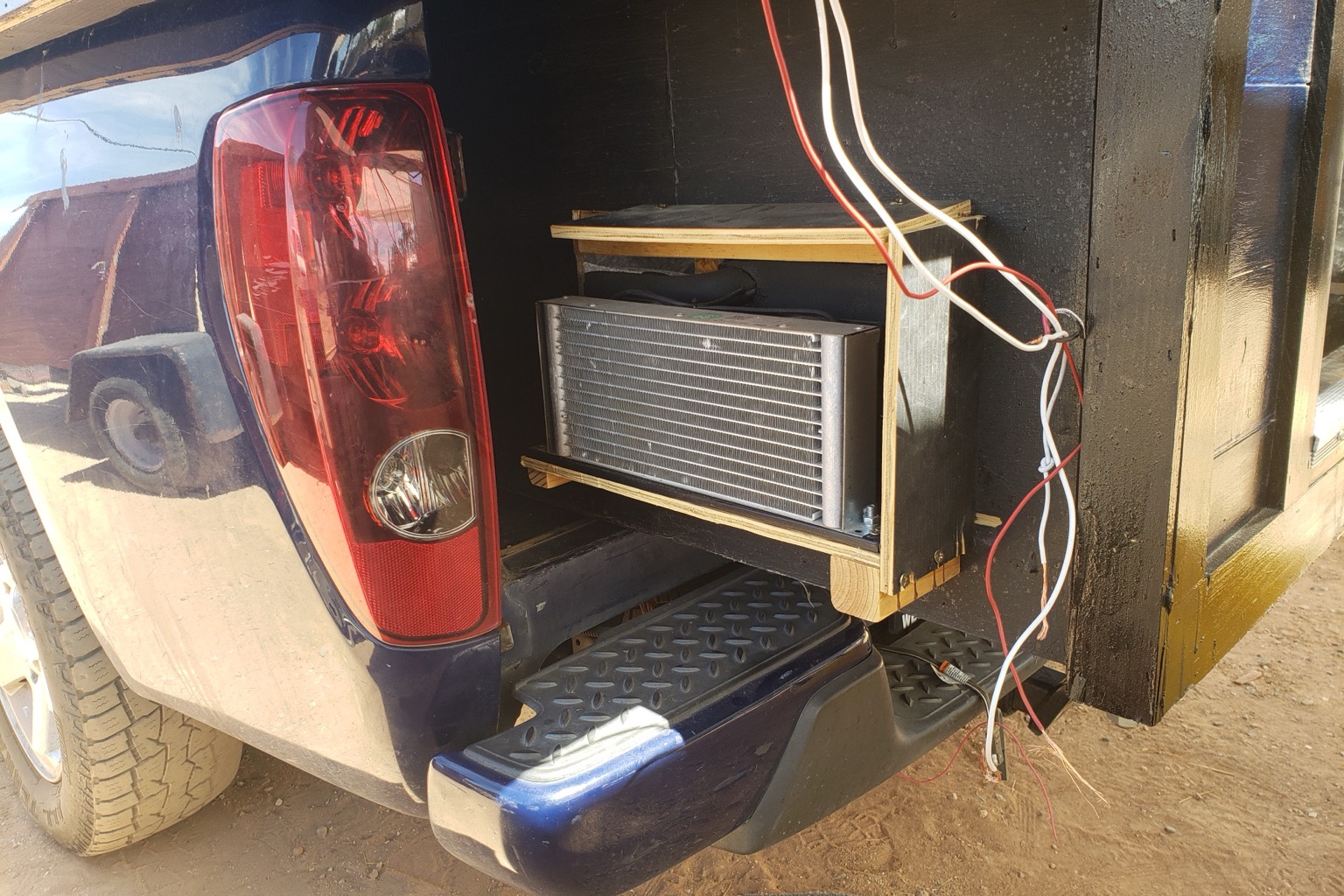 Micro DC Aircon module showing condenser coil, fan and compressor before installation