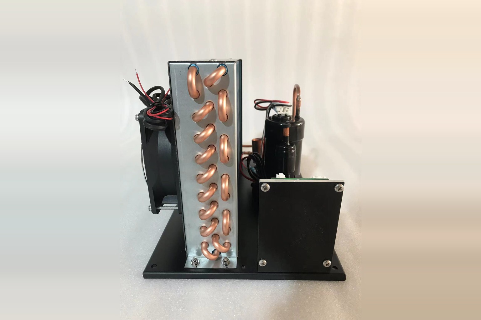 DC condensing unit assembly with compressor and condenser for compact refrigeration