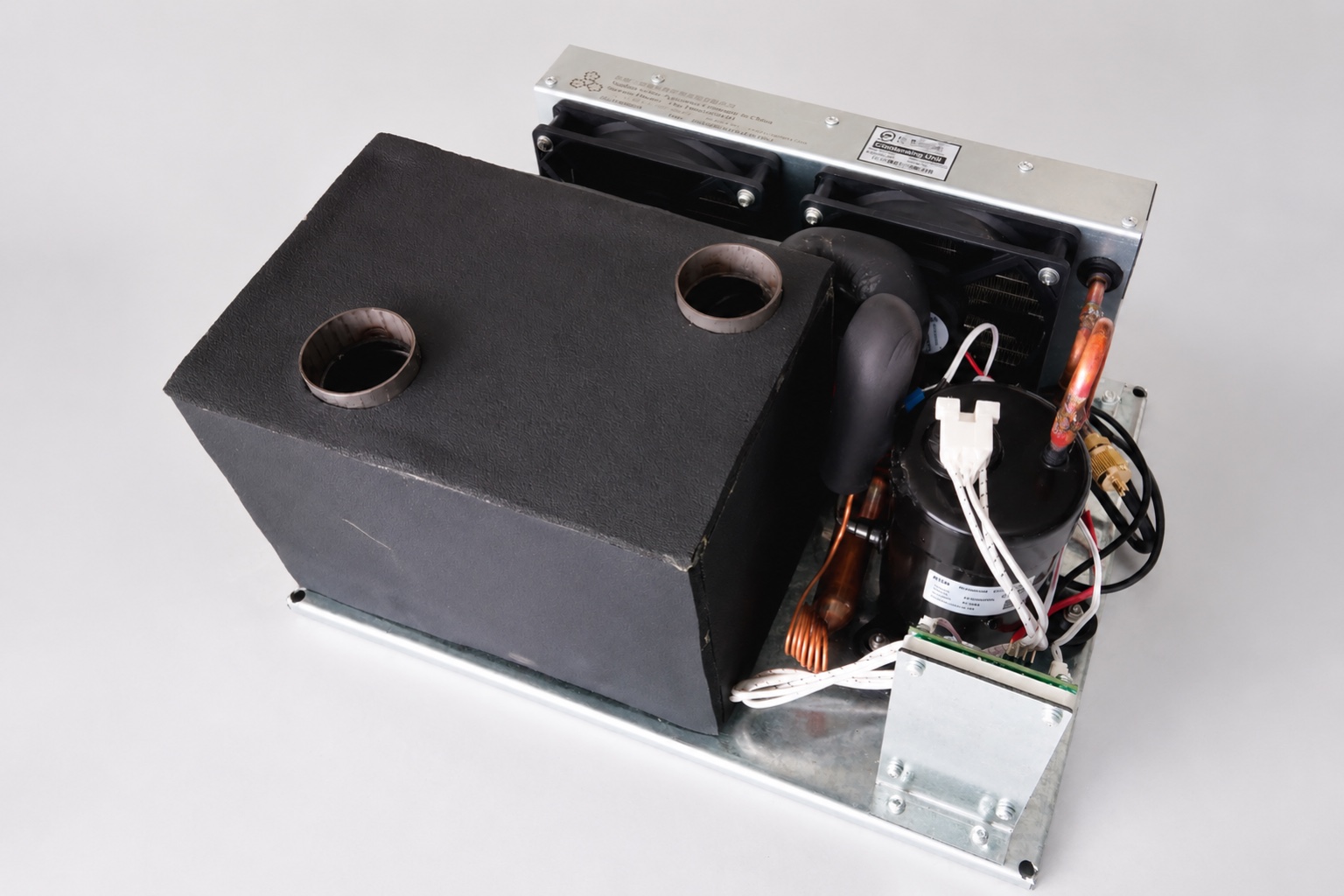 Compact DC air conditioning unit showing supply and return openings