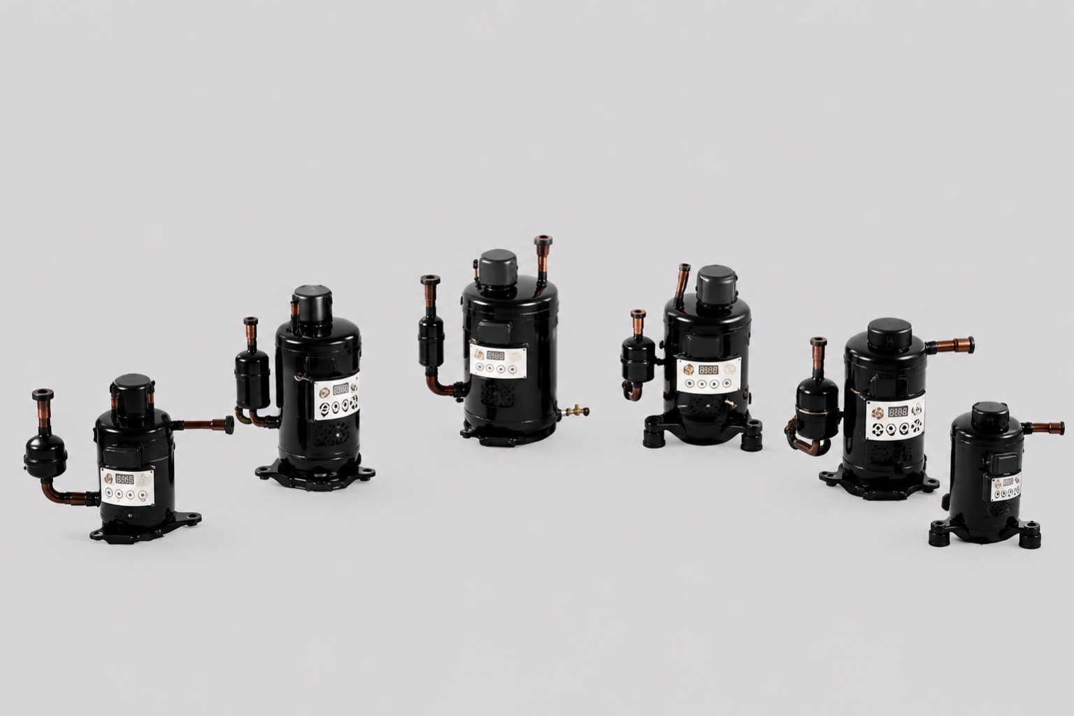 Miniature DC compressor and condenser assembly for an insulated refrigeration box