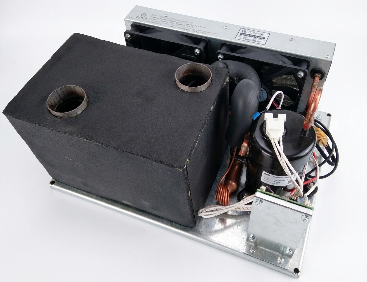 Portable 12V air conditioner installed in vehicle cabin showing DC power connection and airflow direction