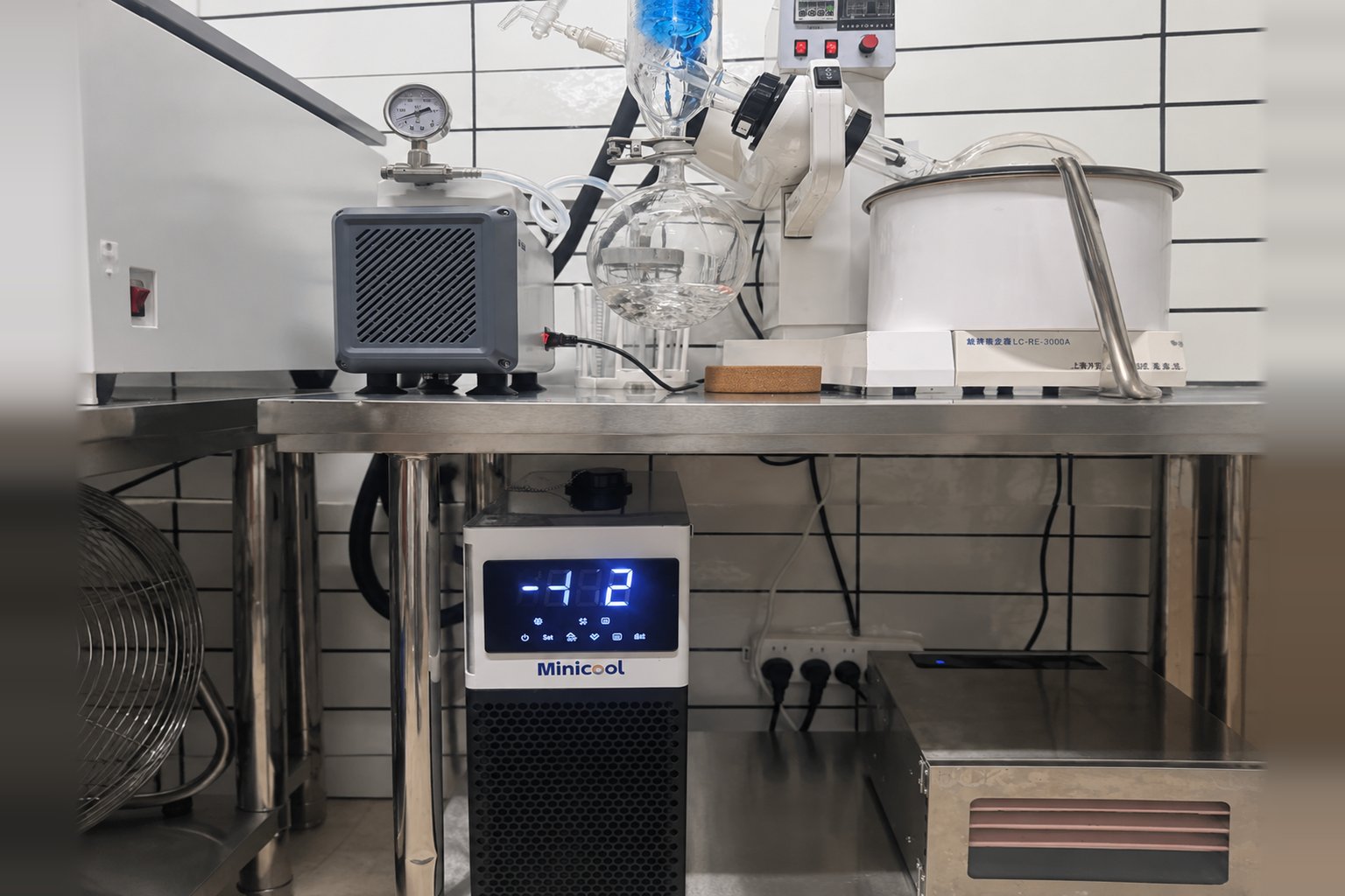MiniCool recirculating chiller under a laboratory bench below a rotary evaporator