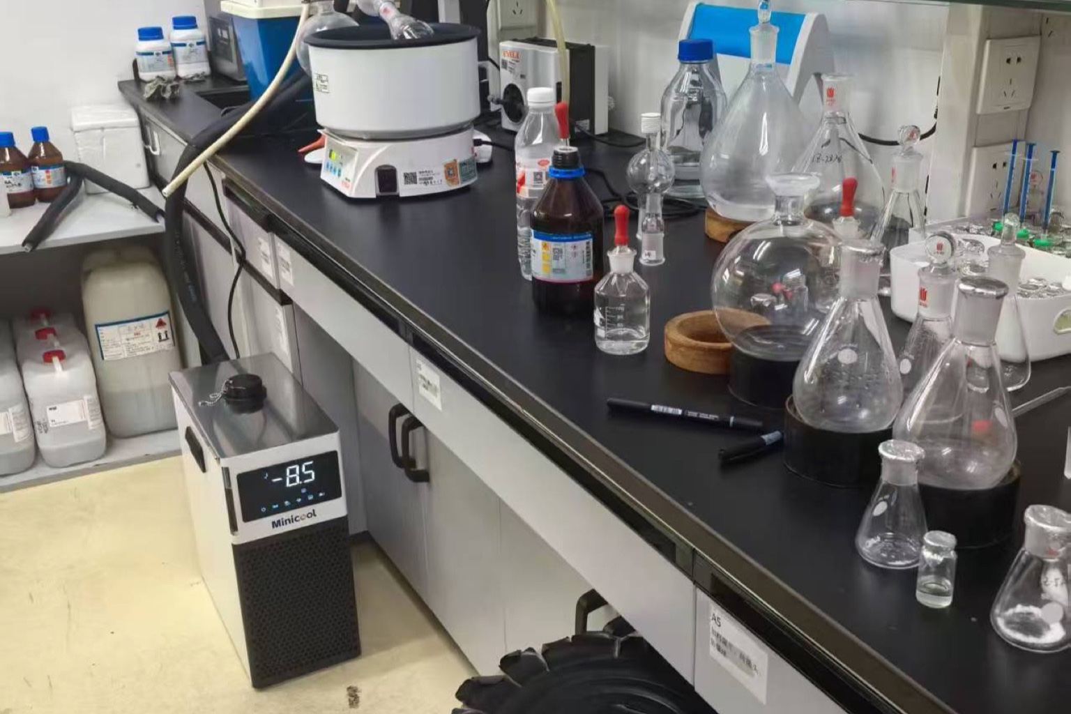 MiniCool countertop recirculating lab chiller displaying a sub-zero setpoint on its digital controller